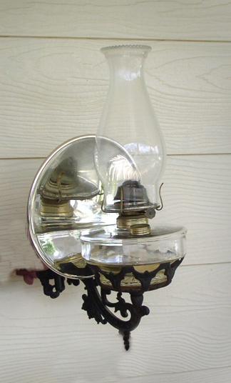 G116 Oil Lamp wall mount with iron base & reflector Wall Auctioneers